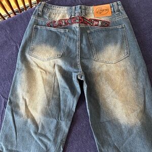 Relaxed Fit Men's Blue Denim Jeans with Embroidered Back Accent